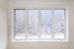 window looking on snow covered trees